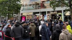 Massive queues shut Swatch stores as hundreds clamour for £335 limited edition watch