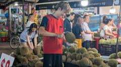 Why £15 durians are being sold at half price - or given away for free