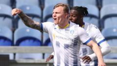 Strugglers Colchester in front against leaders Mansfield – live text