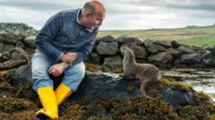 How Billy met Molly - the orphaned otter who is now part of the family