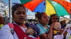 Two mothers protest with their children, demanding the resignation of Sri Lankan President Gotabhaya Rajapaksa. June 29, 2022 Colombo, Sri Lanka