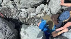 Alaska hiker rescued from under 700lb boulder in frigid creek