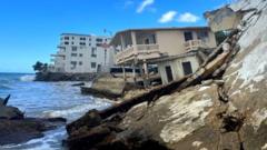 Hilera de estructuras destruidas en el barrio Córcega, en el municipio costero Rincón, Puerto Rico.