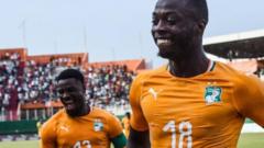 Serge Aurier (left) and Nicolas Pepe are two Ivorian regulars who could face being banned