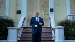 Trump holds a Bible that was carried from the White House by his daughter Ivanka