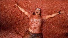 'Mind-blowing': Thousands bathe in tomato sauce at La Tomatina