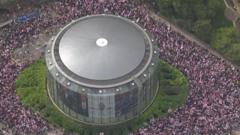 Thousands join Tommy Robinson rally, as counter-protesters demonstrate