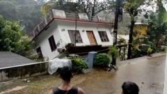 A house fell into an overflowing river on Sunday