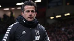 Marco Silva walks down the touchline at Old Trafford after being sent off by referee Chris Kavanagh