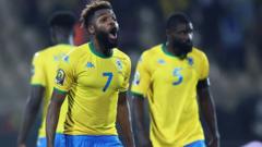 Gabon players react afta referee blow final whistle
