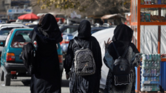 Three female students walking away from university