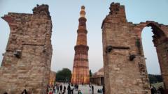 Views of the Qutab Minar the massive Victory Tower, the one thousand year old minaret, a public monument in the heart of New Delhi. Seen on February 20, 2022, the 72.5 meter tall masonry monument is a UNESCO heritage site.