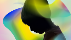 Silhouette of small child against a colourful background