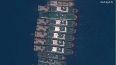 A handout satellite image made available by MAXAR Technologies shows Chinese vessels anchored at the Whitsun Reef in the disputed South China Sea on 23 March 2021 (issued 25 March 2021)