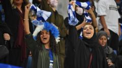 Women supporters of al-Hilal cheer for their team during the AFC Champions League quarter-finals football match between at King Saud University Stadium in Riyadh (17 September 2019)