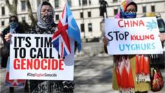 Uyghurs during a demonstration in Parliament Square, London Thursday April 22, 2021