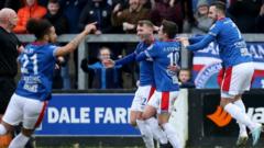 Linfield's Kirk Millar is congratulated after netting against Carrick Rangers in March