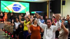 Faithful pray at an evangelical church in Brasilia, on September 21, 2018 for the recovery of the health of Brazilian right-wing presidential candidate Jair Bolsonaro