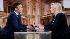 TV image of Emmanuel Macron and Marine Le Pen