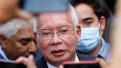 Najib Razak speaks to journalists outside the Federal Court on August 23, 2022