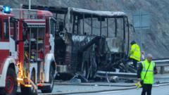 Officials work at the site of a bus accident, in which at least 45 people were killed after the vehicle caught fire, on a highway near the village of Bosnek, south of Sofia, on November 23, 2021