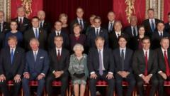 Leaders of Nato alliance countries, and its secretary general, join Britain's Queen Elizabeth and the Prince of Wales