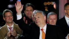 Hungarian Prime Minister Viktor Orban (centre) greets his supporters in Budapest. Photo: 3 April 2022