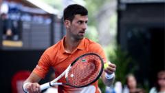 Novak Djokovic prepares to serve