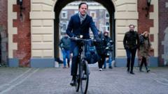 Dutch Prime Minister Mark Rutte arrives by bike for the Council of Ministers at the Binnenhof in The Hague, The Netherlands