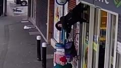 Woman yanked into air by shop shutters finds fame