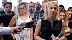 Deputy editor in chief Veronika Munk speaks surrounded by employees at Index.hu on 24 July