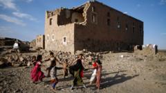 Children play near a building damaged by bombing, Yemen (file pic - November 2018)