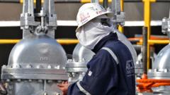 A worker at an oil processing facility of Saudi Aramco in Abqaiq, Saudi Arabia