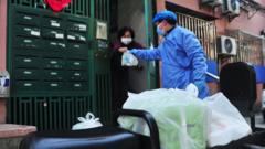 A volunteer delivers food supplies to residents of Shanghai after the city imposed a lockdown