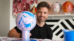 Artist designs striking 'acrylic fusion' footballs
