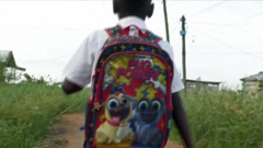 A boy going to an illegal school in Douala, Cameroon