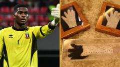 Equatorial Guinea goalkeeper Jesus Owono and gloves previously owned by Michael Jackson