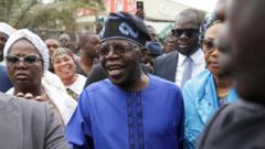 Bola Tinubu arrives at a polling station before casting his ballot in Lagos, Nigeria on 25 February