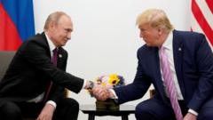 Russia's President Vladimir Putin and former US President Donald Trump shake hands