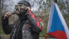 Czech members of motorcycle club 'Night Wolves' lay a wreath on 5 May