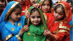 Girls participate in a festival in Amritsar in Punjab