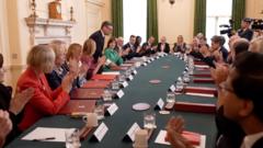 Applause as Burnham arrives for first cabinet meeting as PM