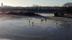 Ice hockey team plays on flood water