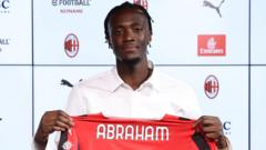 England striker Abraham joins Milan on loan from Roma