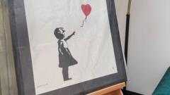 Two men charged over stolen Banksy artwork