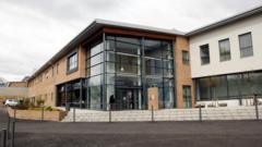 Probe into death of woman found in Glasgow stairwell