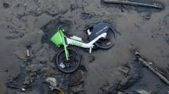 Hundreds of Lime bikes dumped in canals and rivers posing risk of pollution, charity warns
