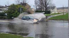 Ice and flood warnings for parts of UK as cool weather continues
