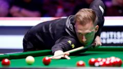 Trump recovers to beat Robertson at UK Championship