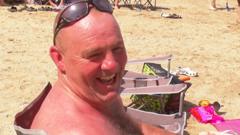 Watch: Beach-goers enjoy the hottest May day on record